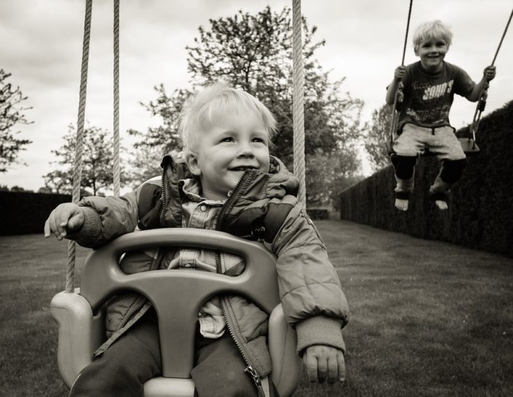 kids swinging outside