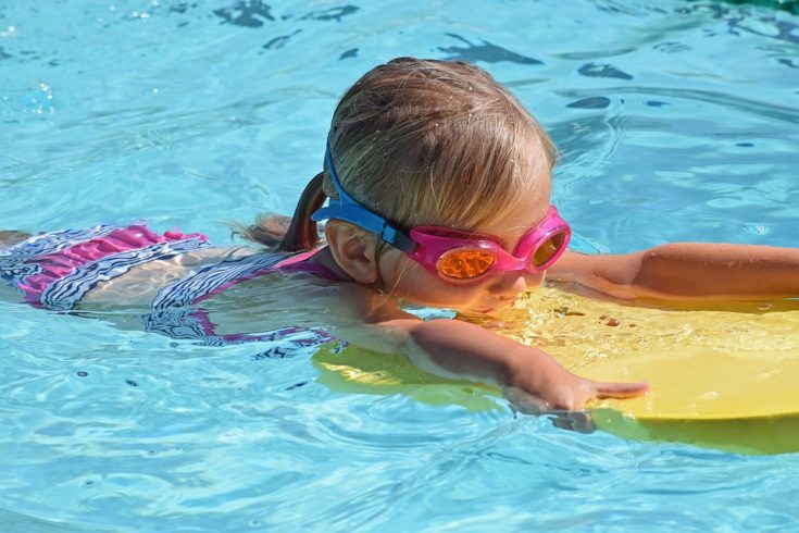 Child Taking Swimming Lessons