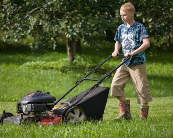 kid mowing lawn